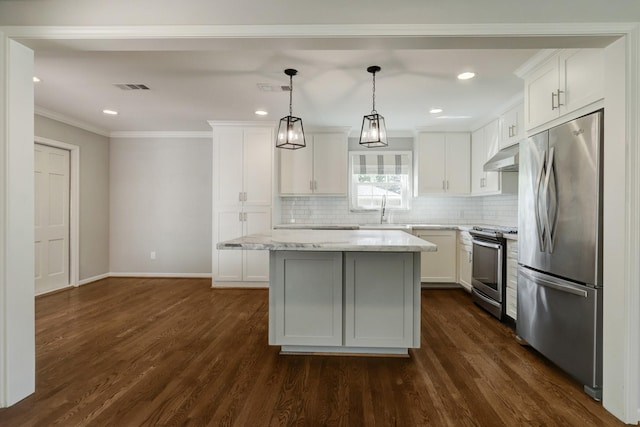 5215 Stillbrooke Dr, Houston, TX 77035 - kitchen with stainless steel appliances, a center island, white cabinetry, tasteful backsplash, and crown molding