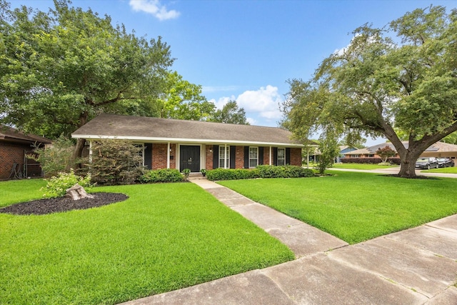 5215 Stillbrooke Dr, Houston, TX 77035 - ranch-style house featuring a front yard and brick siding