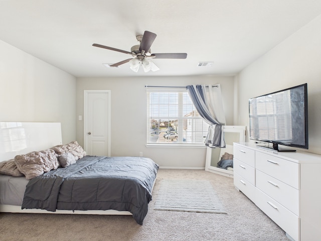12671 Taymouth Manor Dr Unit 6, Humble, TX 77346 - bedroom with light carpet, a ceiling fan, and baseboards