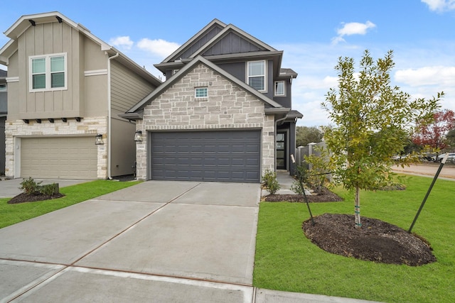 2906 Park Hill Ln, Stafford, TX 77477 - view of front of home featuring stone siding, board and batten siding, driveway, a front yard, and a garage