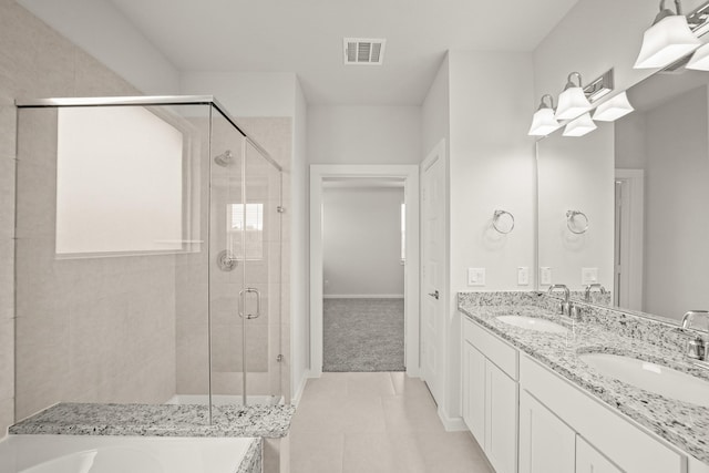 2906 Park Hill Ln, Stafford, TX 77477 - bathroom featuring a stall shower, a tub to relax in, double vanity, tile patterned flooring, and baseboards