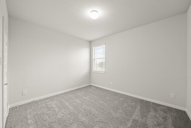 2906 Park Hill Ln, Stafford, TX 77477 - empty room featuring carpet and baseboards