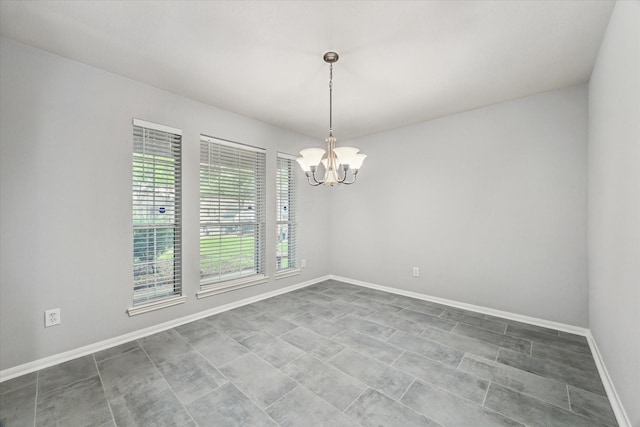 1056 Inverness Cv, Dickinson, TX 77539 - unfurnished room featuring a chandelier and baseboards
