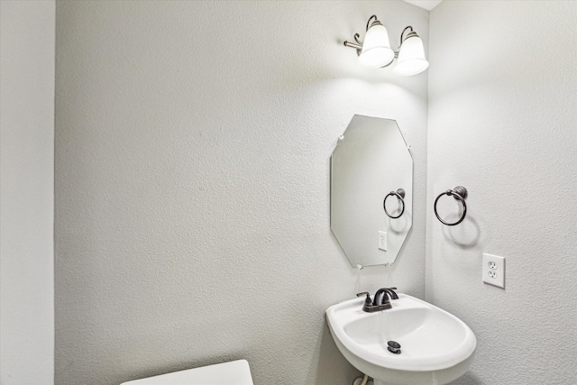 1056 Inverness Cv, Dickinson, TX 77539 - bathroom featuring a sink and toilet