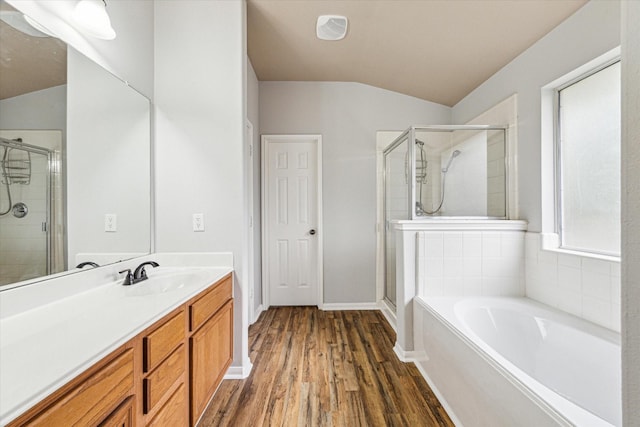 1056 Inverness Cv, Dickinson, TX 77539 - full bath featuring a shower stall, lofted ceiling, vanity, and a bath