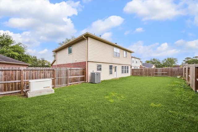 1056 Inverness Cv, Dickinson, TX 77539 - rear view of property featuring central AC and brick siding