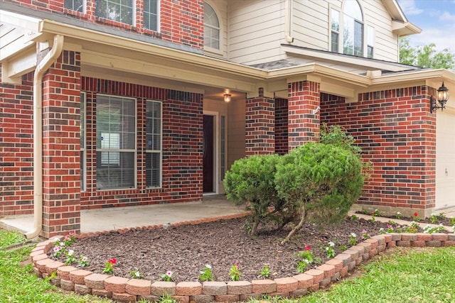 1056 Inverness Cv, Dickinson, TX 77539 - property entrance with brick siding and a garage