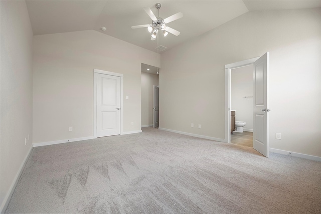 658 Cherry Tree Dr, La Marque, TX 77568 - unfurnished bedroom with light colored carpet, ensuite bath, baseboards, and high vaulted ceiling