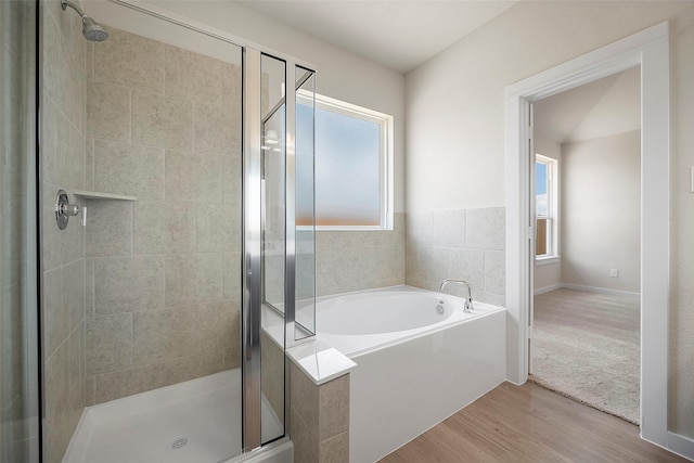 658 Cherry Tree Dr, La Marque, TX 77568 - full bath featuring a shower stall, a bath, and wood finished floors