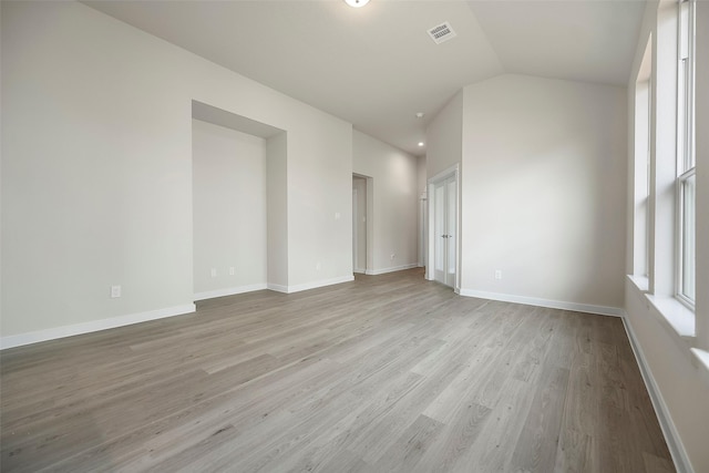 658 Cherry Tree Dr, La Marque, TX 77568 - unfurnished room featuring vaulted ceiling, light wood-style floors, and baseboards