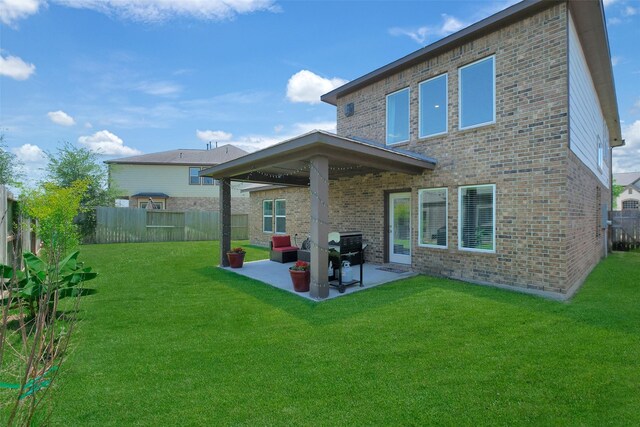 6323 Grand Summit Ct, Katy, TX 77494 - back of property featuring brick siding and a patio area