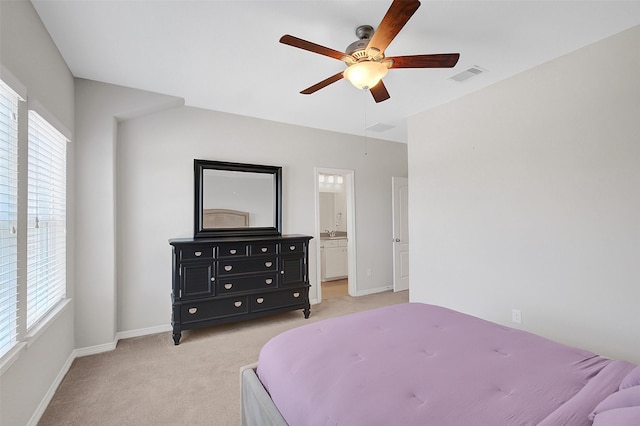 6323 Grand Summit Ct, Katy, TX 77494 - bedroom with light colored carpet, baseboards, a ceiling fan, and ensuite bathroom