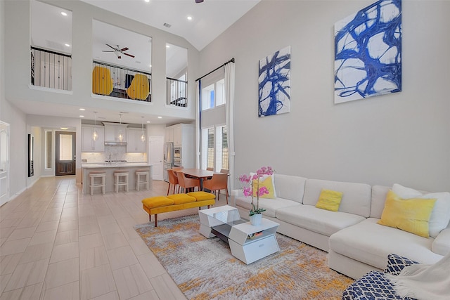 6323 Grand Summit Ct, Katy, TX 77494 - living area with a ceiling fan and a towering ceiling