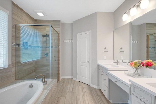 6323 Grand Summit Ct, Katy, TX 77494 - bathroom with a stall shower, double vanity, a garden tub, and healthy amount of natural light
