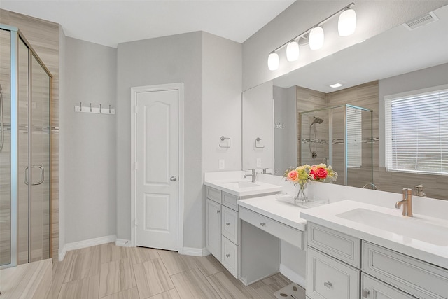 6323 Grand Summit Ct, Katy, TX 77494 - bathroom featuring a stall shower, double vanity, and baseboards
