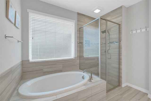 6323 Grand Summit Ct, Katy, TX 77494 - full bathroom featuring a stall shower, a garden tub, and baseboards