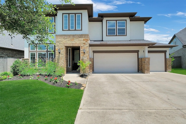 6323 Grand Summit Ct, Katy, TX 77494 - view of front facade with stucco siding, driveway, stone siding, and an attached garage