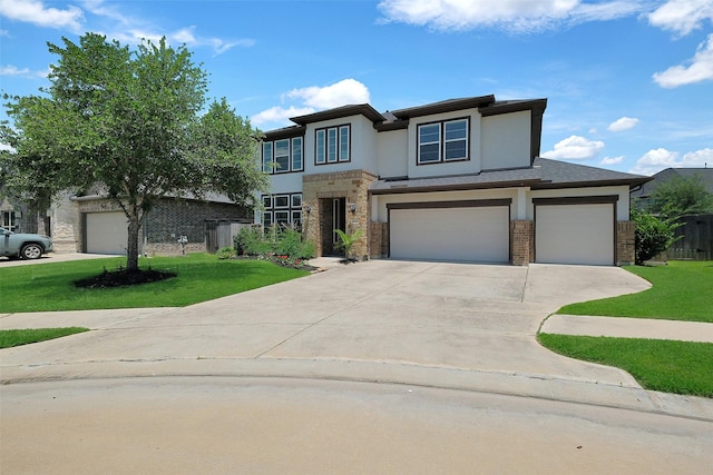 6323 Grand Summit Ct, Katy, TX 77494 - view of front facade featuring concrete driveway, stucco siding, stone siding, and an attached garage