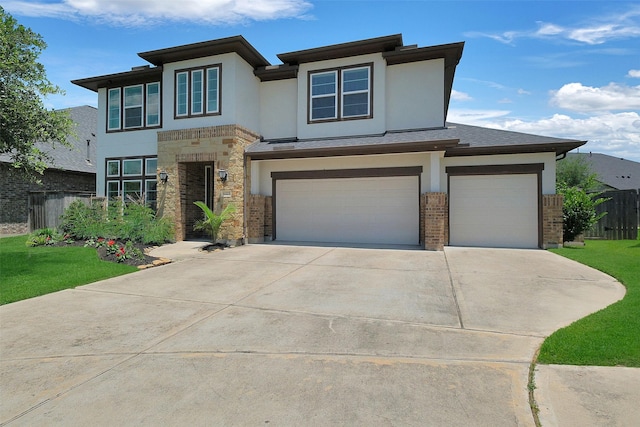 6323 Grand Summit Ct, Katy, TX 77494 - view of front of home with stone siding, concrete driveway, stucco siding, and an attached garage