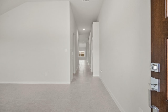 666 Cherry Tree Dr, La Marque, TX 77568 - corridor featuring recessed lighting, baseboards, light tile patterned floors, and vaulted ceiling