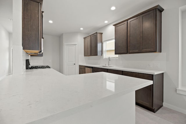 666 Cherry Tree Dr, La Marque, TX 77568 - kitchen with a sink, dark brown cabinets, recessed lighting, range with gas stovetop, and stainless steel dishwasher