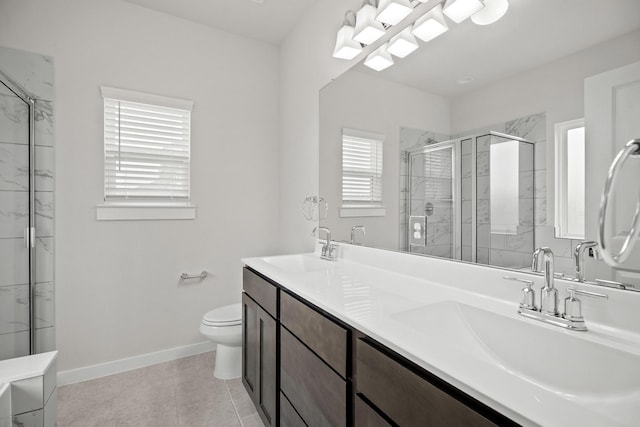 666 Cherry Tree Dr, La Marque, TX 77568 - bathroom with a stall shower, toilet, baseboards, and double vanity