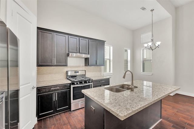 34 N Hutcheson St, Houston, TX 77003 - kitchen featuring stainless steel appliances, a sink, under cabinet range hood, and dark wood-type flooring