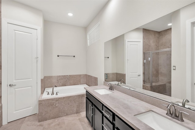 34 N Hutcheson St, Houston, TX 77003 - full bathroom featuring a stall shower, a bath, double vanity, recessed lighting, and tile patterned flooring