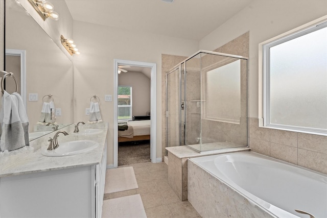 635 W Linnwood Dr, Woodbranch, TX 77357 - ensuite bathroom featuring a shower stall, a garden tub, tile patterned flooring, and double vanity