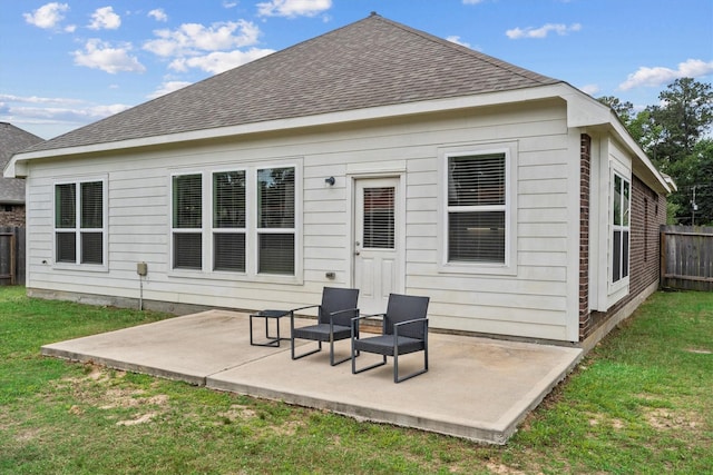 635 W Linnwood Dr, Woodbranch, TX 77357 - back of house with roof with shingles and a patio area