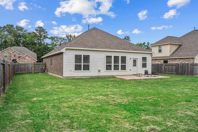635 W Linnwood Dr, Woodbranch, TX 77357 - rear view of property featuring a patio, central AC, and a shingled roof