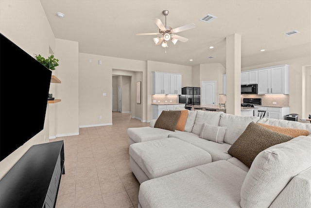 635 W Linnwood Dr, Woodbranch, TX 77357 - living room with a ceiling fan, recessed lighting, baseboards, and light tile patterned flooring
