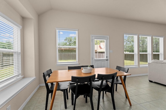 635 W Linnwood Dr, Woodbranch, TX 77357 - dining area featuring healthy amount of natural light, light tile patterned floors, and lofted ceiling