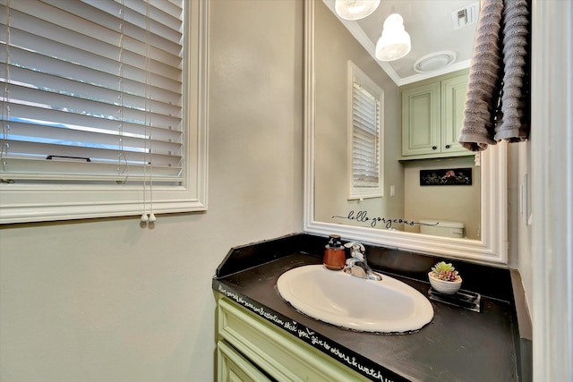 bathroom featuring vanity and crown molding