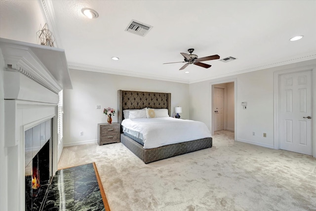 bedroom featuring a fireplace with flush hearth, carpet floors, recessed lighting, baseboards, and crown molding