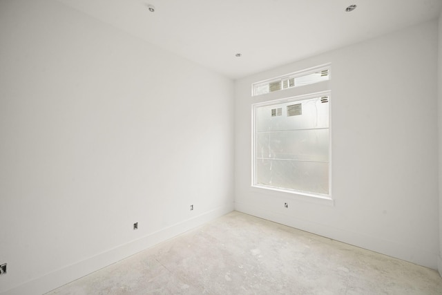 5223 Mimosa Dr, Bellaire, TX 77401 - unfurnished room with unfinished concrete floors and baseboards
