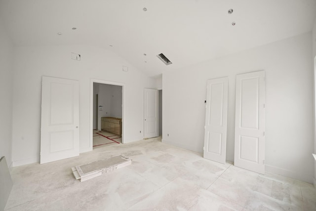 5223 Mimosa Dr, Bellaire, TX 77401 - unfurnished bedroom with vaulted ceiling and ensuite bathroom