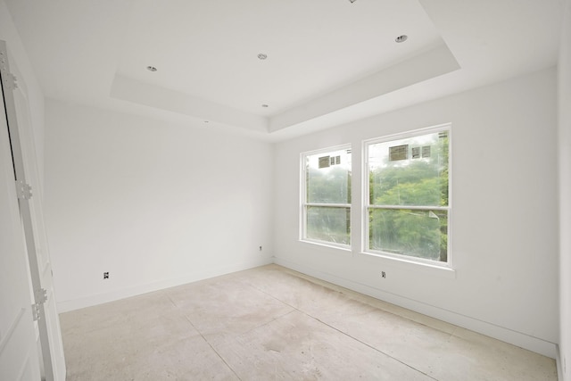 5223 Mimosa Dr, Bellaire, TX 77401 - spare room featuring a raised ceiling and baseboards