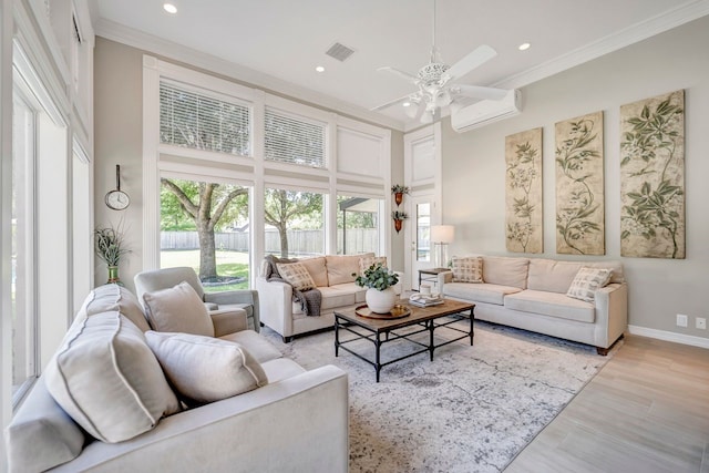 206 Greenbriar Ave, Friendswood, TX 77546 - living room featuring an AC wall unit, ceiling fan, healthy amount of natural light, recessed lighting, and crown molding