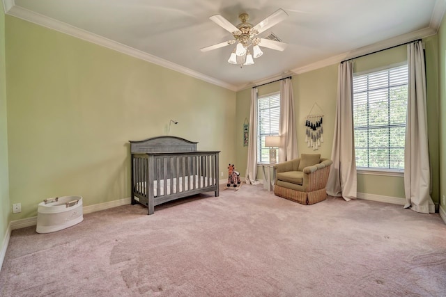 206 Greenbriar Ave, Friendswood, TX 77546 - carpeted bedroom with crown molding, baseboards, a nursery area, and a ceiling fan