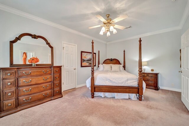 206 Greenbriar Ave, Friendswood, TX 77546 - bedroom with ornamental molding, light carpet, baseboards, and ceiling fan