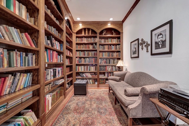 206 Greenbriar Ave, Friendswood, TX 77546 - living area with bookshelves, crown molding, built in features, and wood finished floors