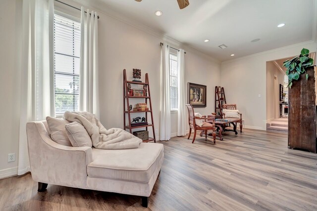 206 Greenbriar Ave, Friendswood, TX 77546 - sitting room with a ceiling fan, light wood finished floors, crown molding, baseboards, and recessed lighting