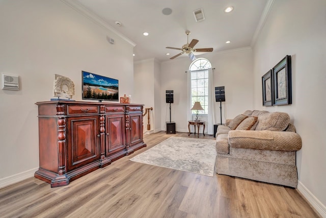 206 Greenbriar Ave, Friendswood, TX 77546 - living area with ornamental molding, light wood-style floors, baseboards, ceiling fan, and recessed lighting
