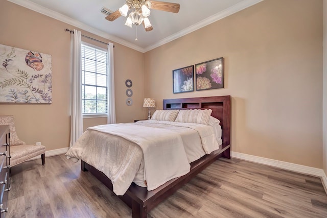 206 Greenbriar Ave, Friendswood, TX 77546 - bedroom with wood finished floors, baseboards, ornamental molding, and ceiling fan