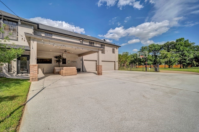 206 Greenbriar Ave, Friendswood, TX 77546 - view of patio / terrace with concrete driveway, an attached garage, and an outdoor living space