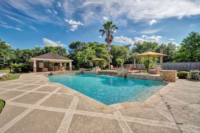206 Greenbriar Ave, Friendswood, TX 77546 - view of swimming pool with a gazebo, a patio, fence, a pool with connected hot tub, and view of scattered trees