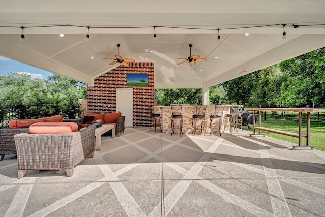 206 Greenbriar Ave, Friendswood, TX 77546 - view of patio / terrace featuring ceiling fan, an outdoor hangout area, and view of wooded area