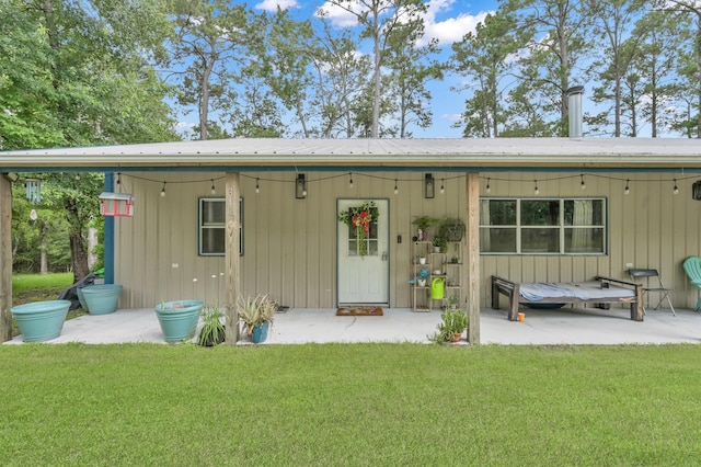 315 Cessna Rd, Trinity, TX 75862 - back of house featuring a lawn and metal roof