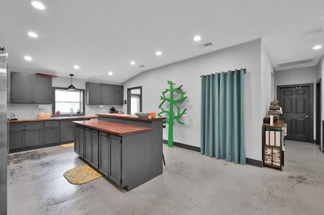 315 Cessna Rd, Trinity, TX 75862 - kitchen featuring wood counters, finished concrete floors, a sink, recessed lighting, and gray cabinets